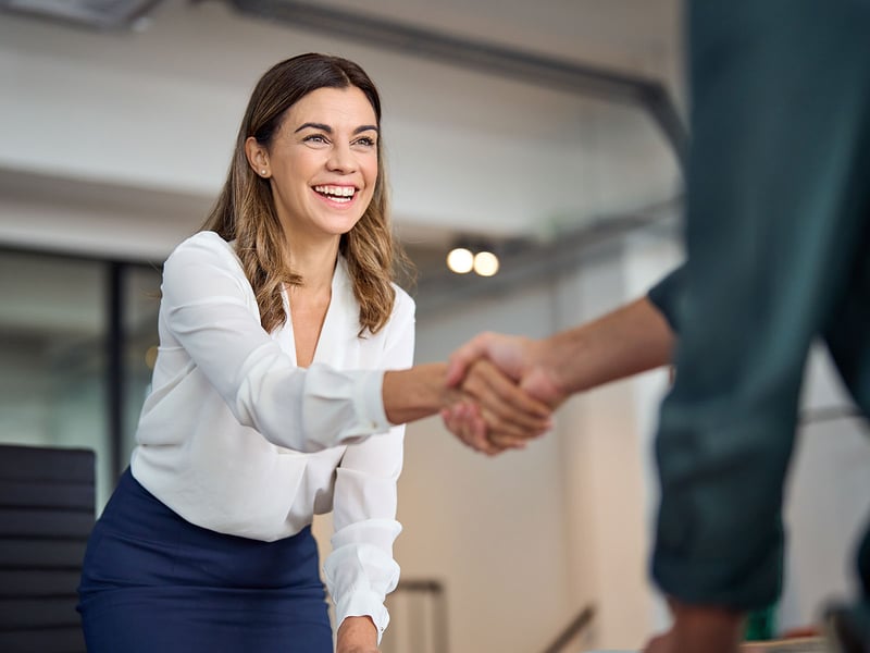 Woman shaking hands with partner